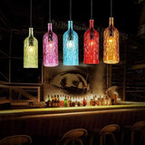 Hanglamp met gekleurde glazen flessen