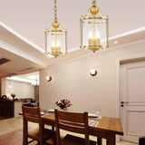 Hanglamp met goud in glazen lantaarnvorm