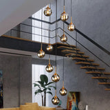 Gouden kroonluchter modern met bolvormige metalen ringen