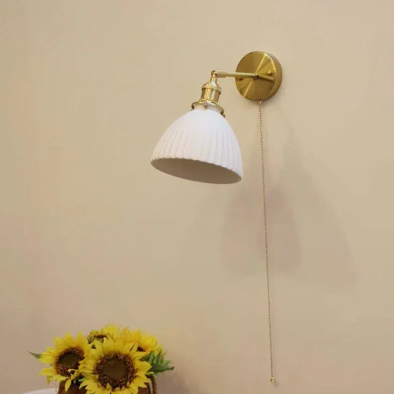 Wandlamp in koperen kleur met schakelaar