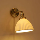 Wandlamp in koperen kleur met schakelaar