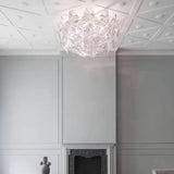 Plafondlamp wit met transparante bladen samengesteld