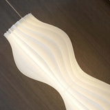 Staande vloerlamp woonkamer witte golvende vorm
