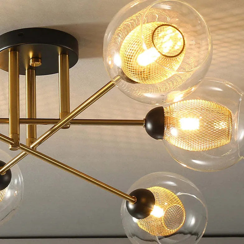 Kroonluchter glazen bollen gouden woonkamer