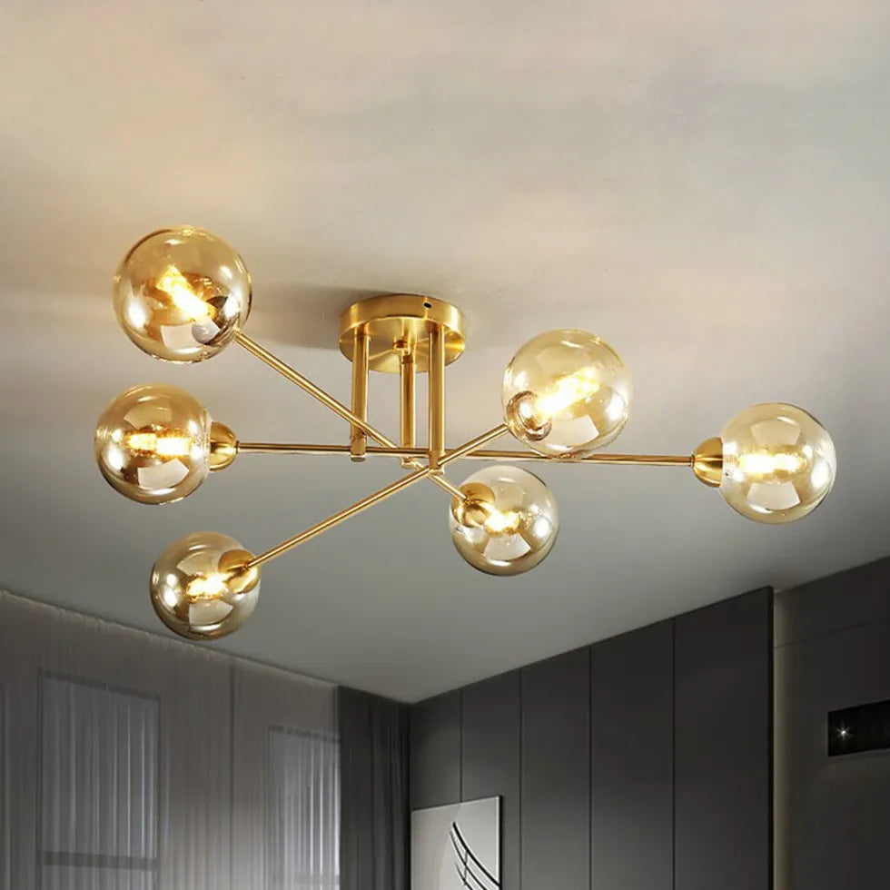 Kroonluchter glazen bollen gouden woonkamer