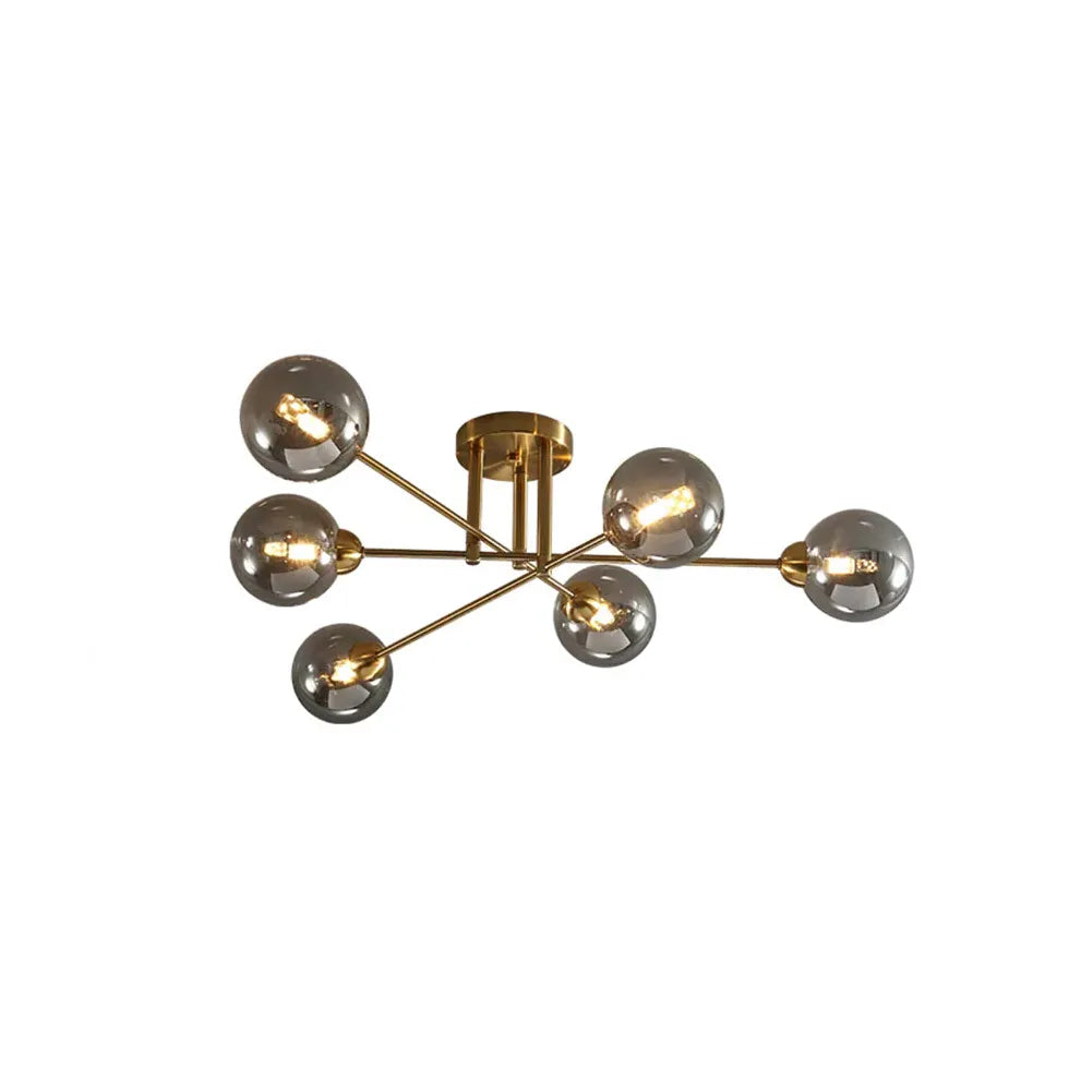 Kroonluchter glazen bollen gouden woonkamer