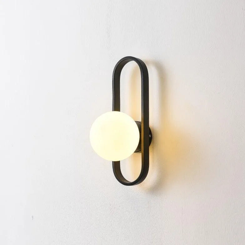 Wandlamp met gouden ovalen frame slaapkamer