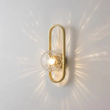 Wandlamp met gouden ovalen frame slaapkamer