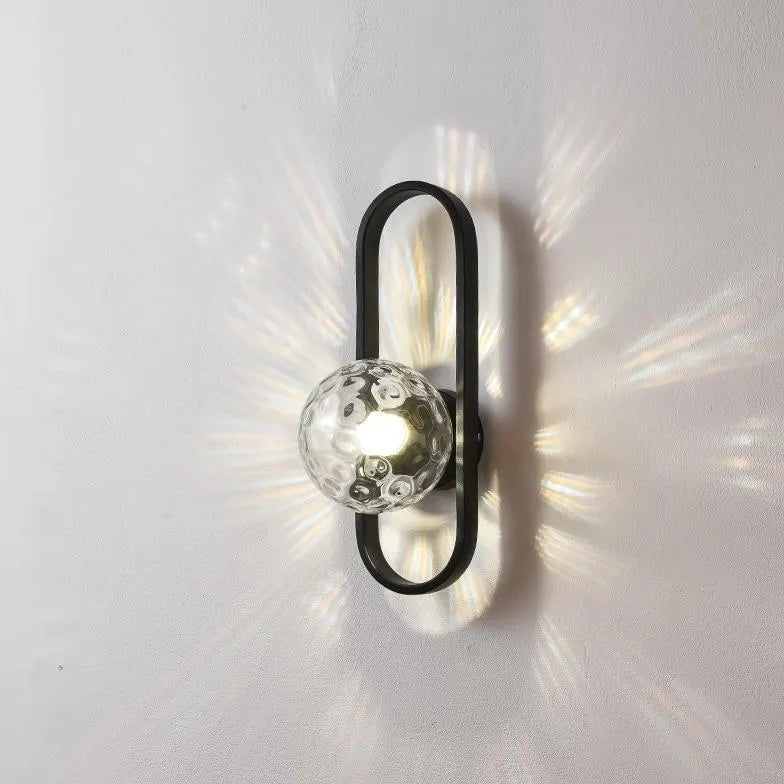 Wandlamp met gouden ovalen frame slaapkamer