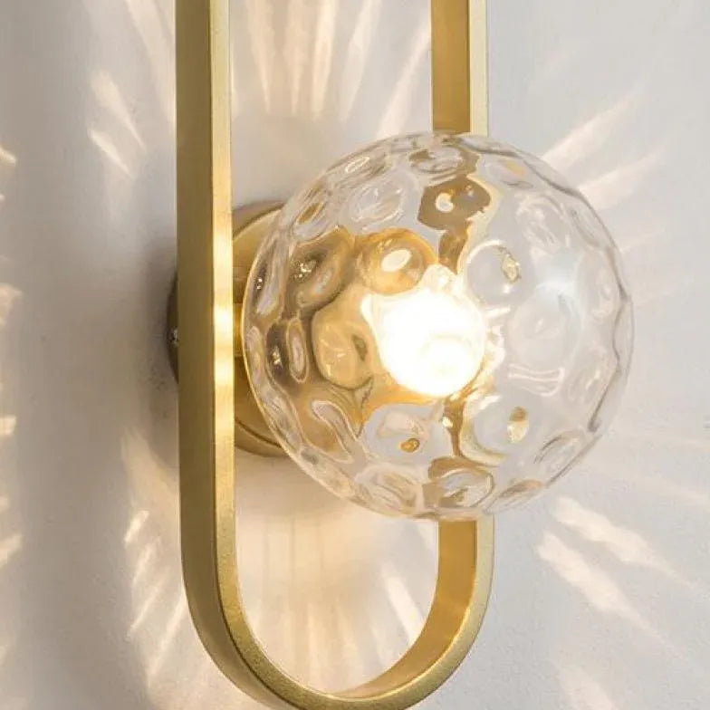 Wandlamp met gouden ovalen frame slaapkamer