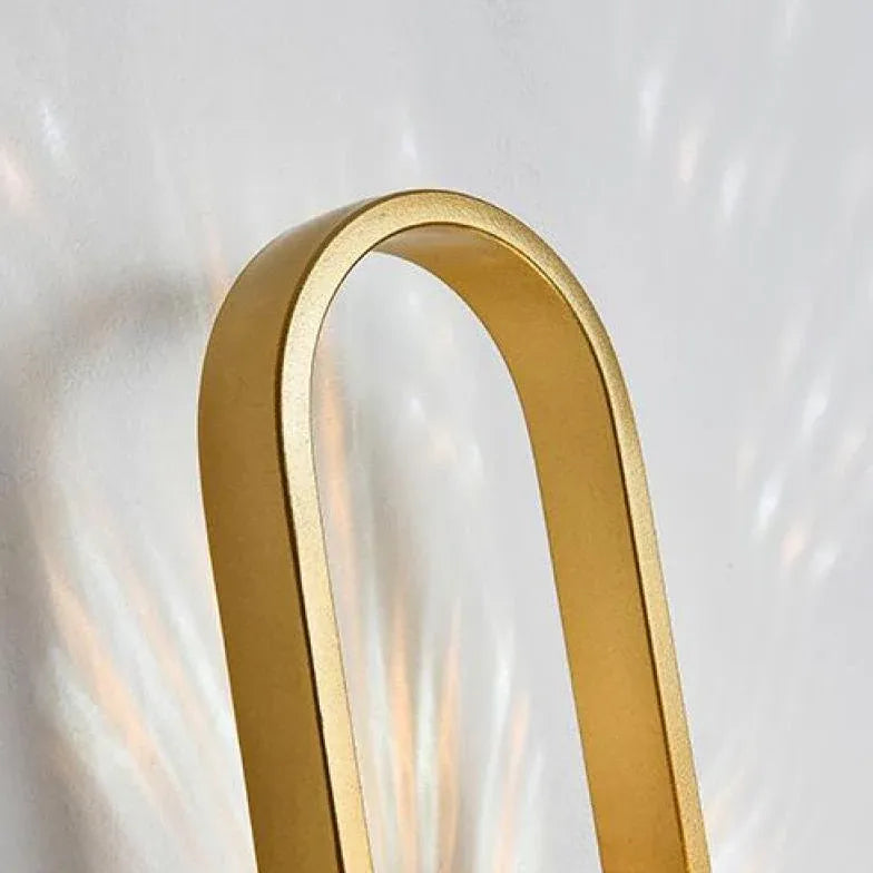 Wandlamp met gouden ovalen frame slaapkamer